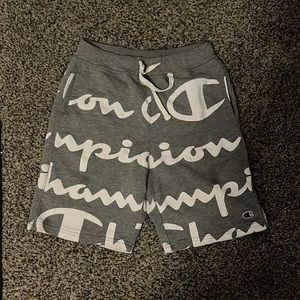 All grey champion shorts with white champion lettering